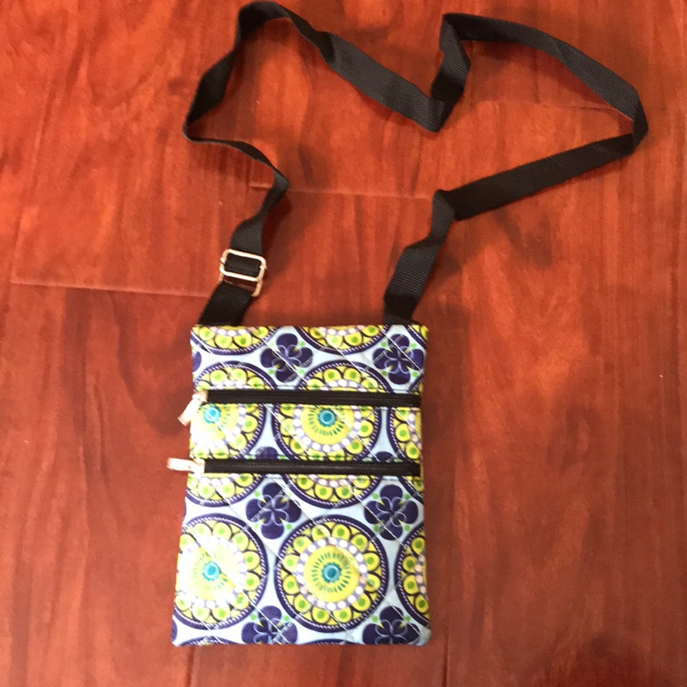 Cross over bag with three multi-purpose pockets